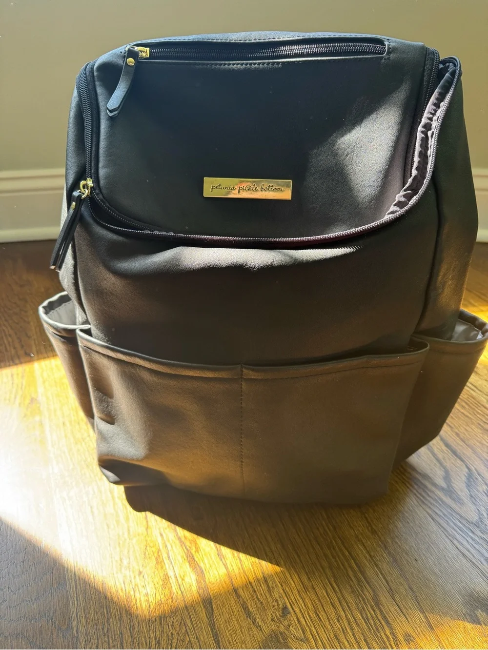 Petunia Pickle Bottom Black Diaper Backpack with Gold Accents